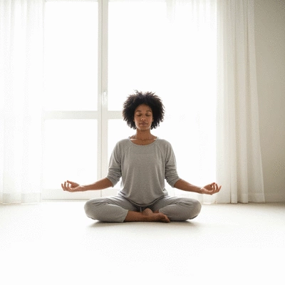 Person meditating or doing mindfulness to cope with allergy stress, in a calm indoor setting