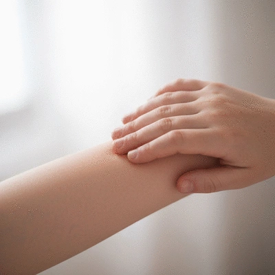 Close-up of a child's hand gently touching a smooth, healthy patch of skin, symbolizing relief and well-being